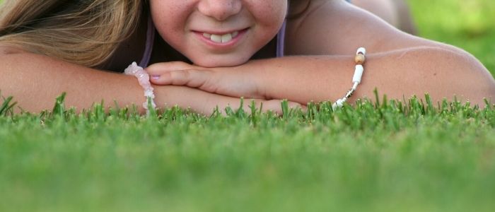 girl on grass in summer